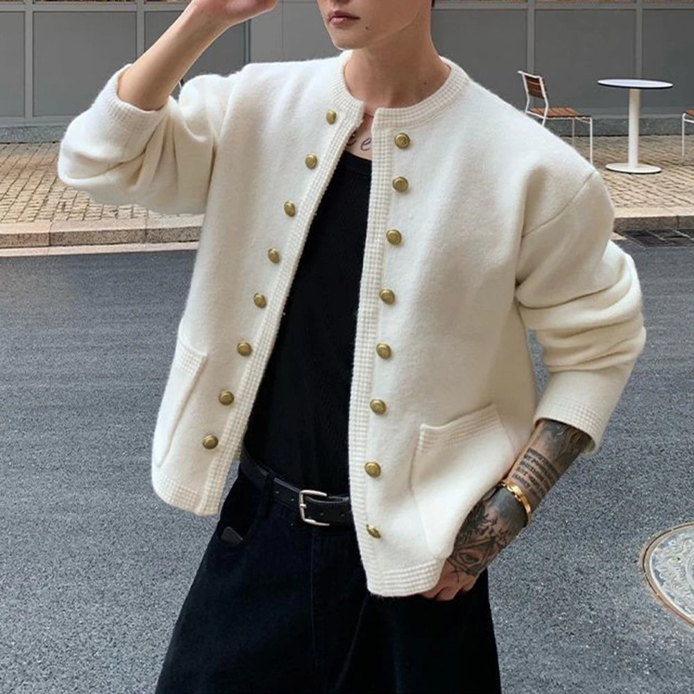 Man wearing white knit cardigan with gold buttons, front view