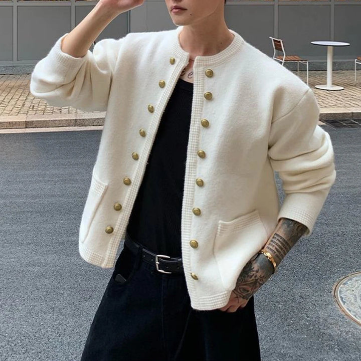 Man wearing white knit cardigan with gold buttons, front view