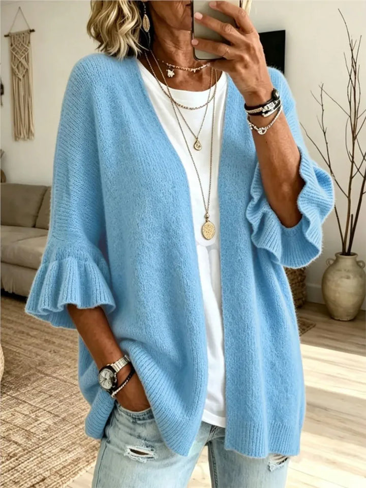 Light blue knit cardigan with ruffle sleeves, front view