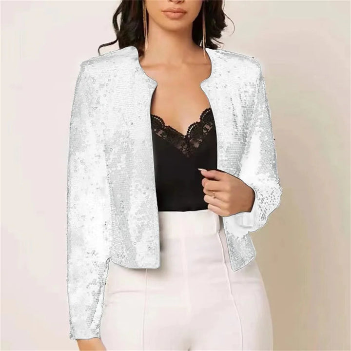 Woman wearing white sequin jacket over black lace top