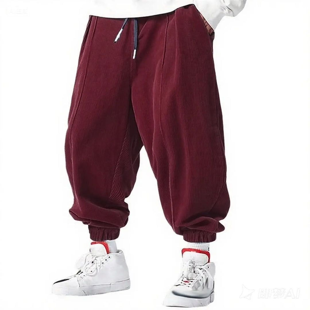 Man wearing deep wine red corduroy jogger pants