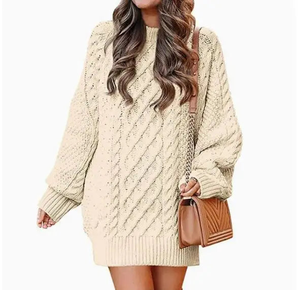 Cream cable knit sweater dress on white background