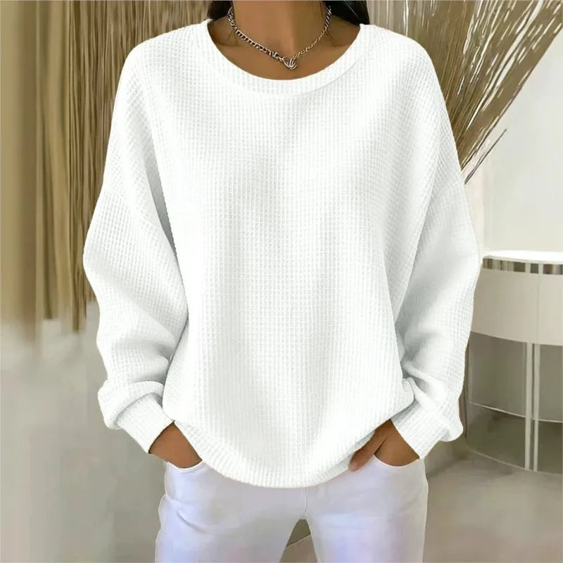 Woman wearing white waffle knit oversized top