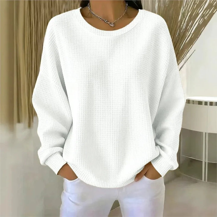 Woman wearing white waffle knit oversized top