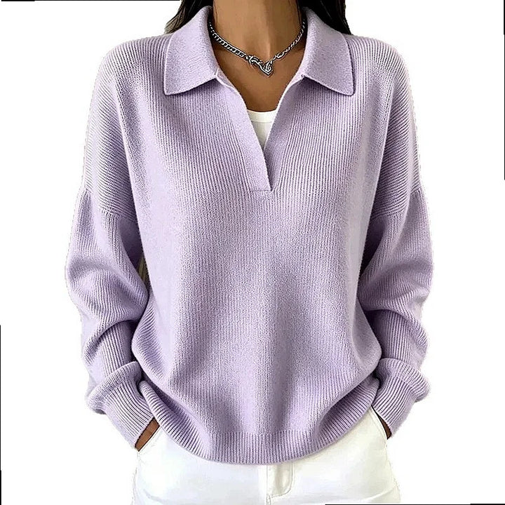 Woman wearing light purple ribbed knit polo sweater with deep V neckline