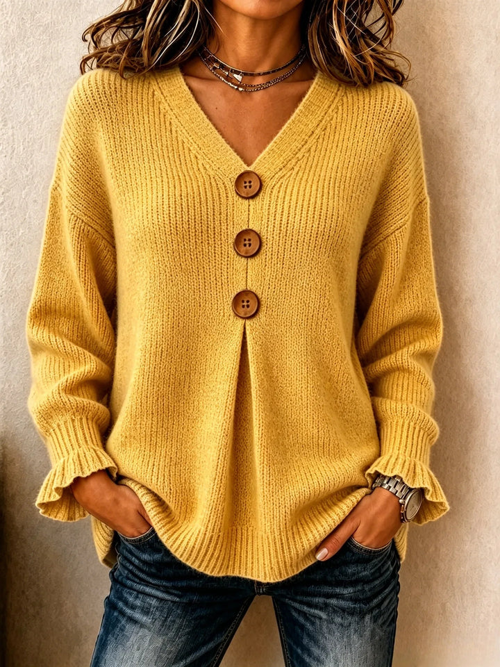Yellow ribbed knit sweater with wood button placket, front view