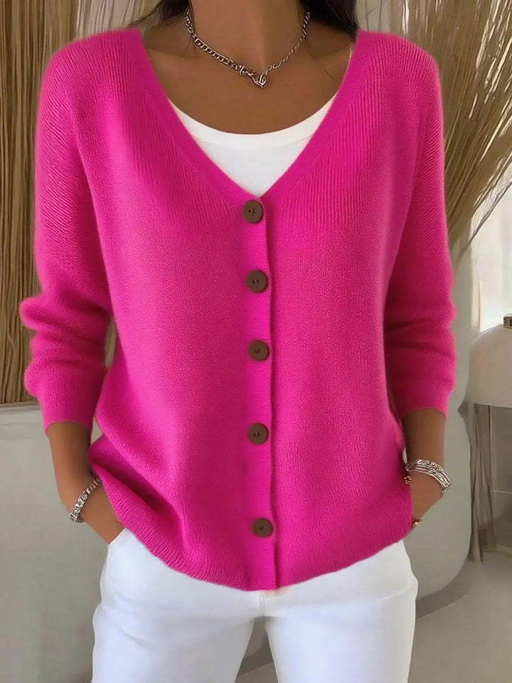Woman wearing hot pink button front knit cardigan