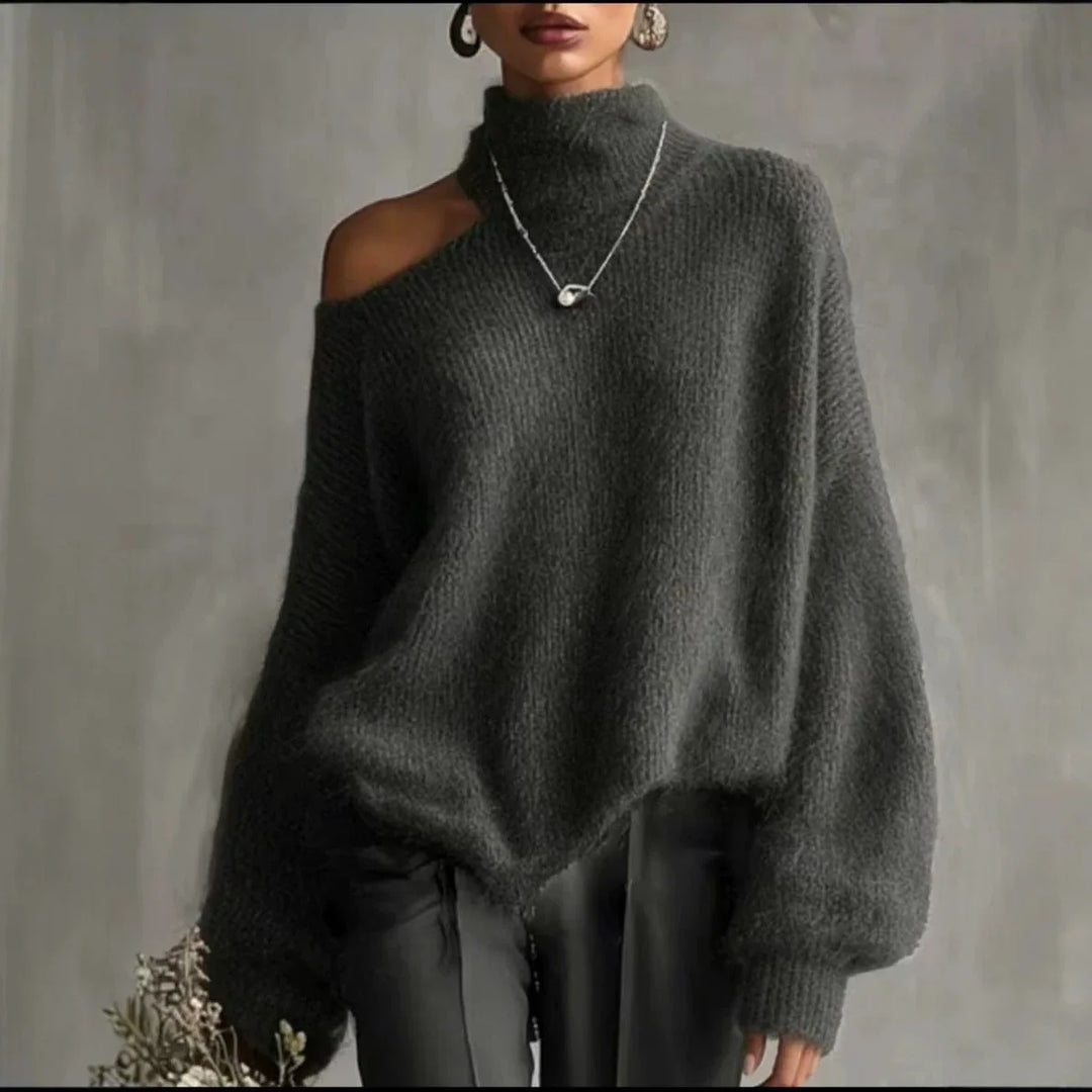 Woman wearing charcoal grey cutout shoulder turtleneck sweater