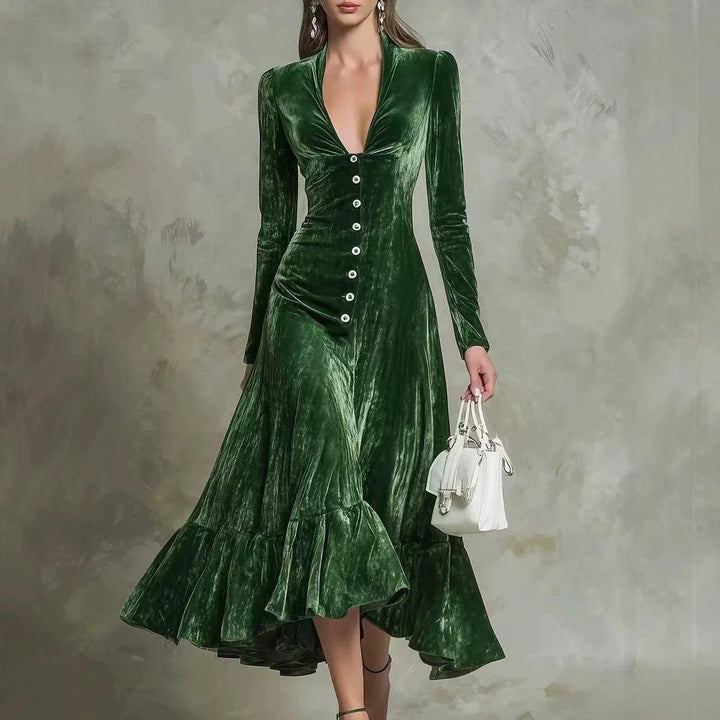 Woman in green velvet midi dress with jeweled buttons