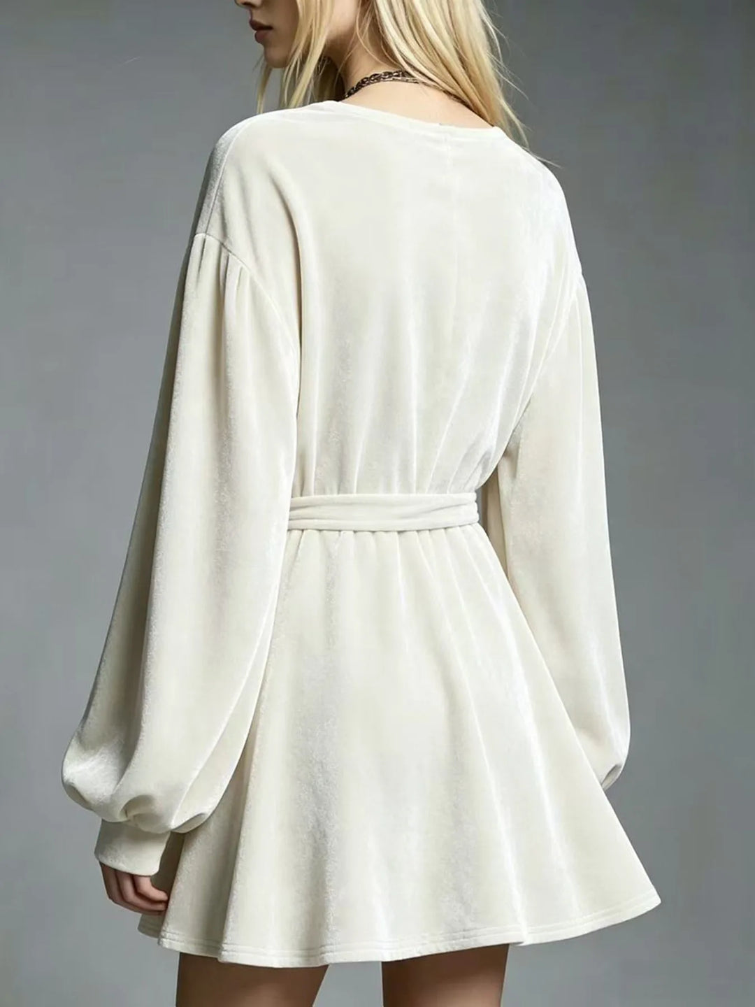 Ivory velvet mini dress back view showing tie belt and A-line skirt