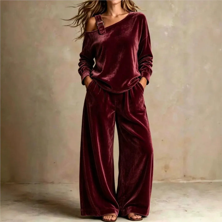 Woman wearing burgundy velvet off shoulder top and wide leg pants set