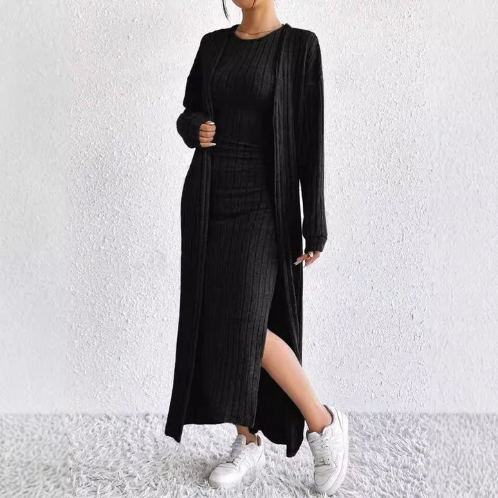 Close view of black ribbed sheath dress with side slit and long cardigan