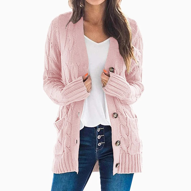 Woman wearing pink cable knit cardigan