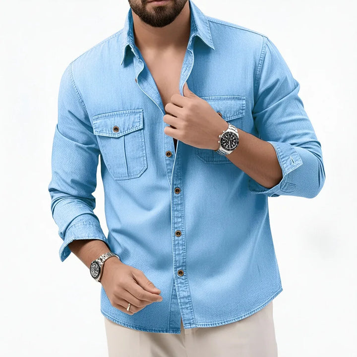 Man wearing blue button-front shirt with flap chest pockets