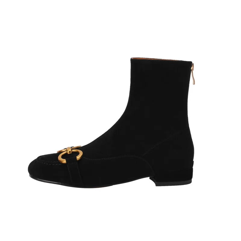 Black suede ankle boot with gold horsebit buckle, side view