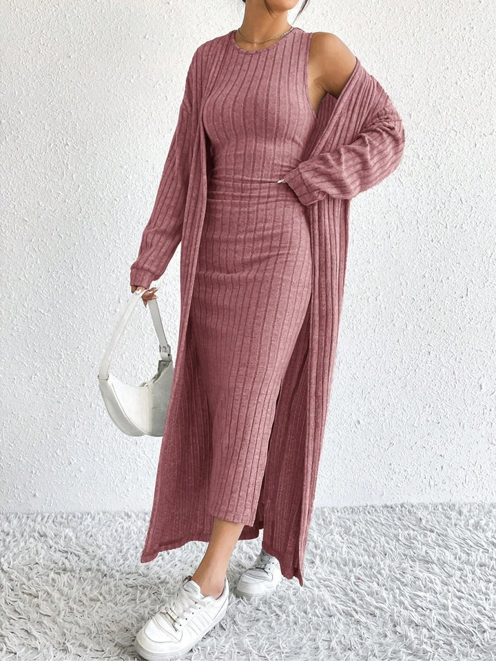 Woman wearing pink ribbed sheath dress with matching long duster cardigan