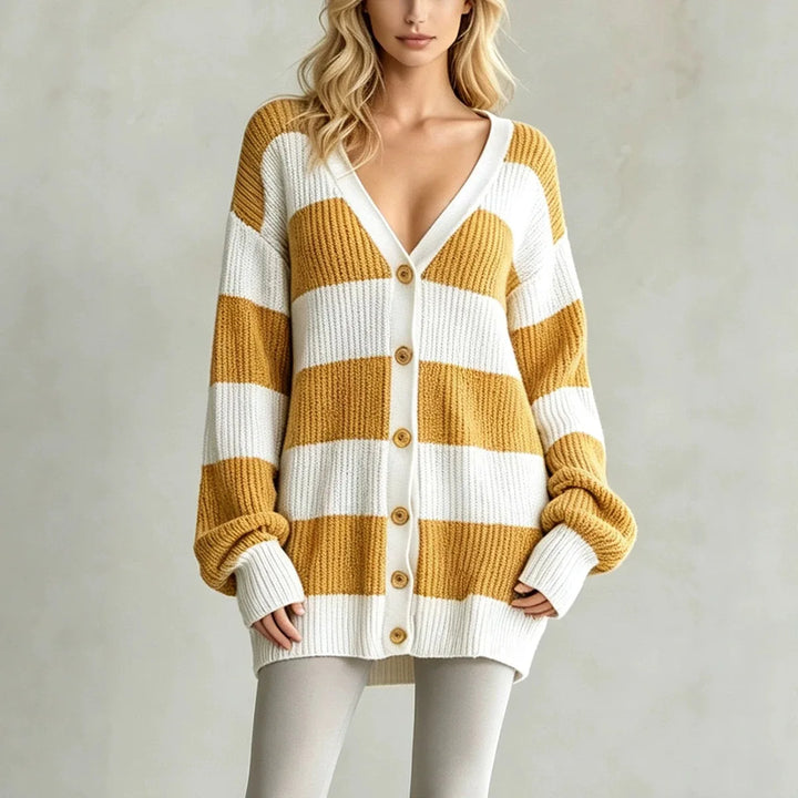 Woman wearing yellow and white striped oversized cardigan sweater
