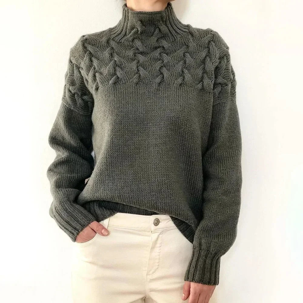 Dark grey cable knit turtleneck sweater, front view