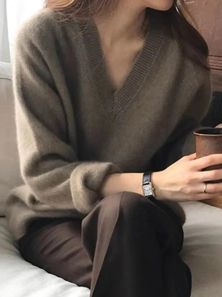 Chestnut brown V-neck sweater with ribbed cuffs