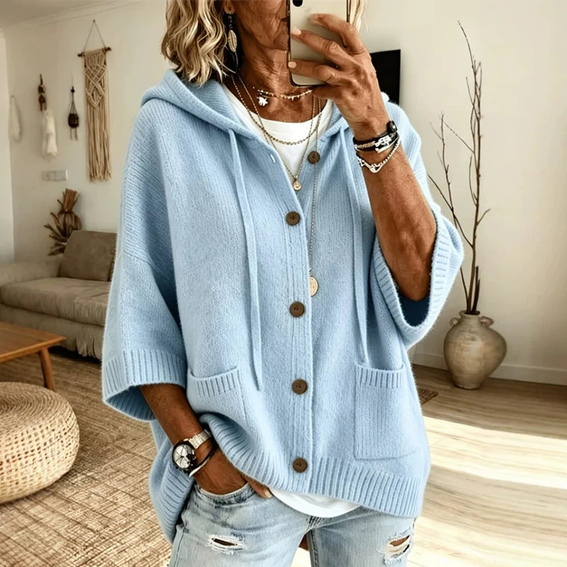 Close view of light blue hooded button-front knit cardigan