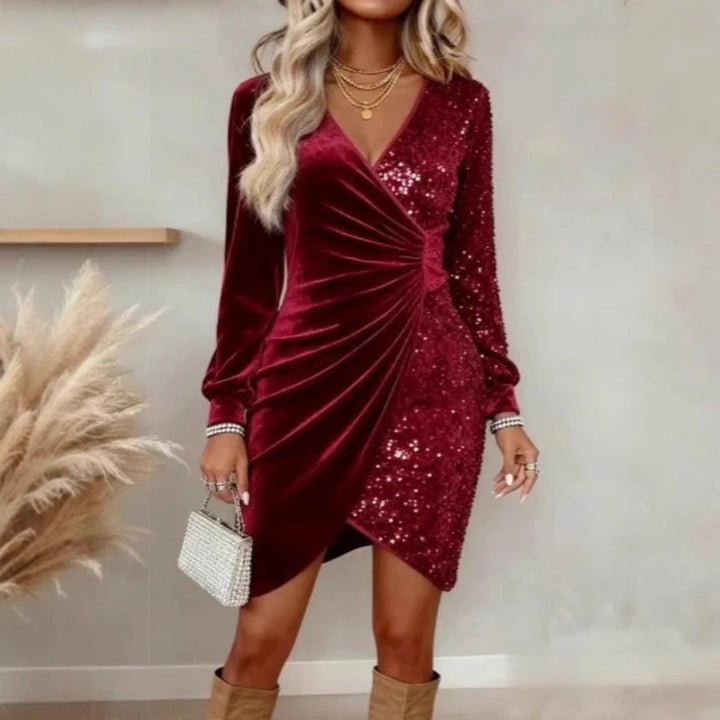 Woman wearing burgundy velvet sequin wrap dress