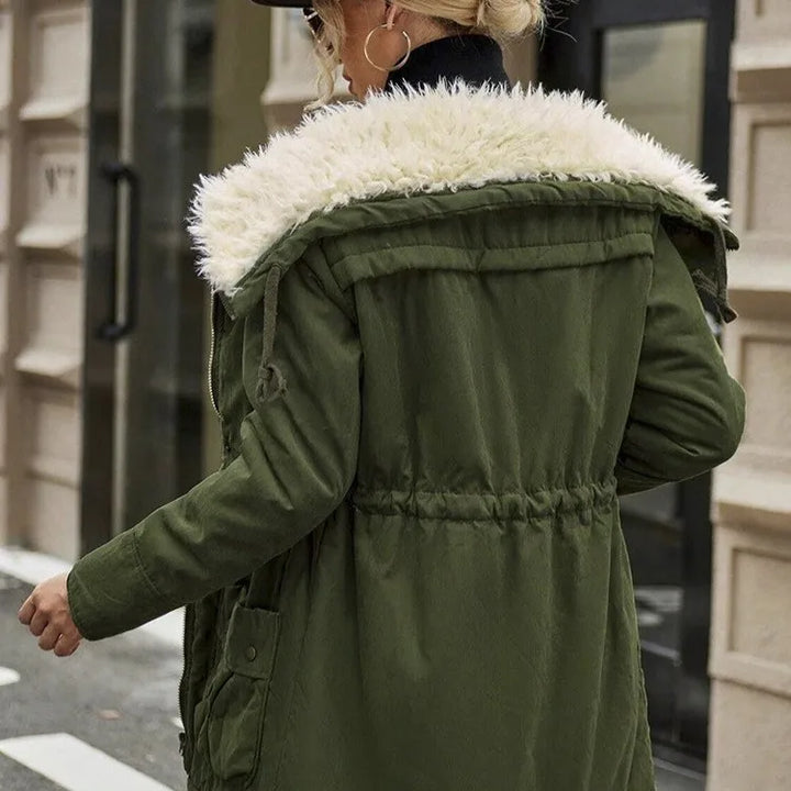 Back view of military green parka with hood and drawstring waist