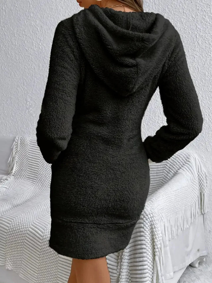 Back view of black fuzzy hooded mini dress