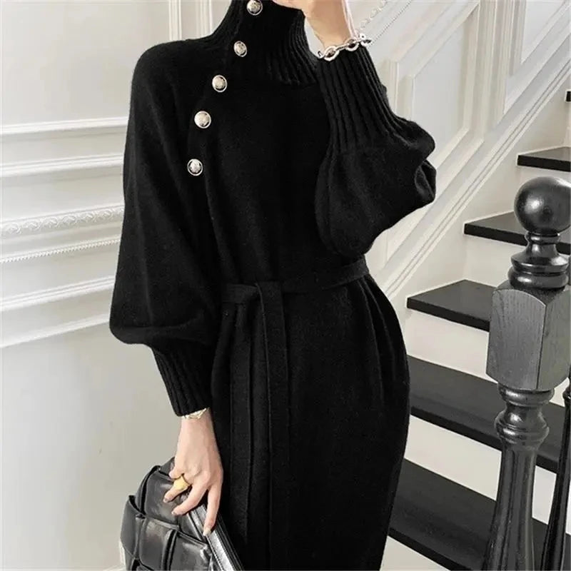 Black turtleneck sweater dress with button detail and tie belt