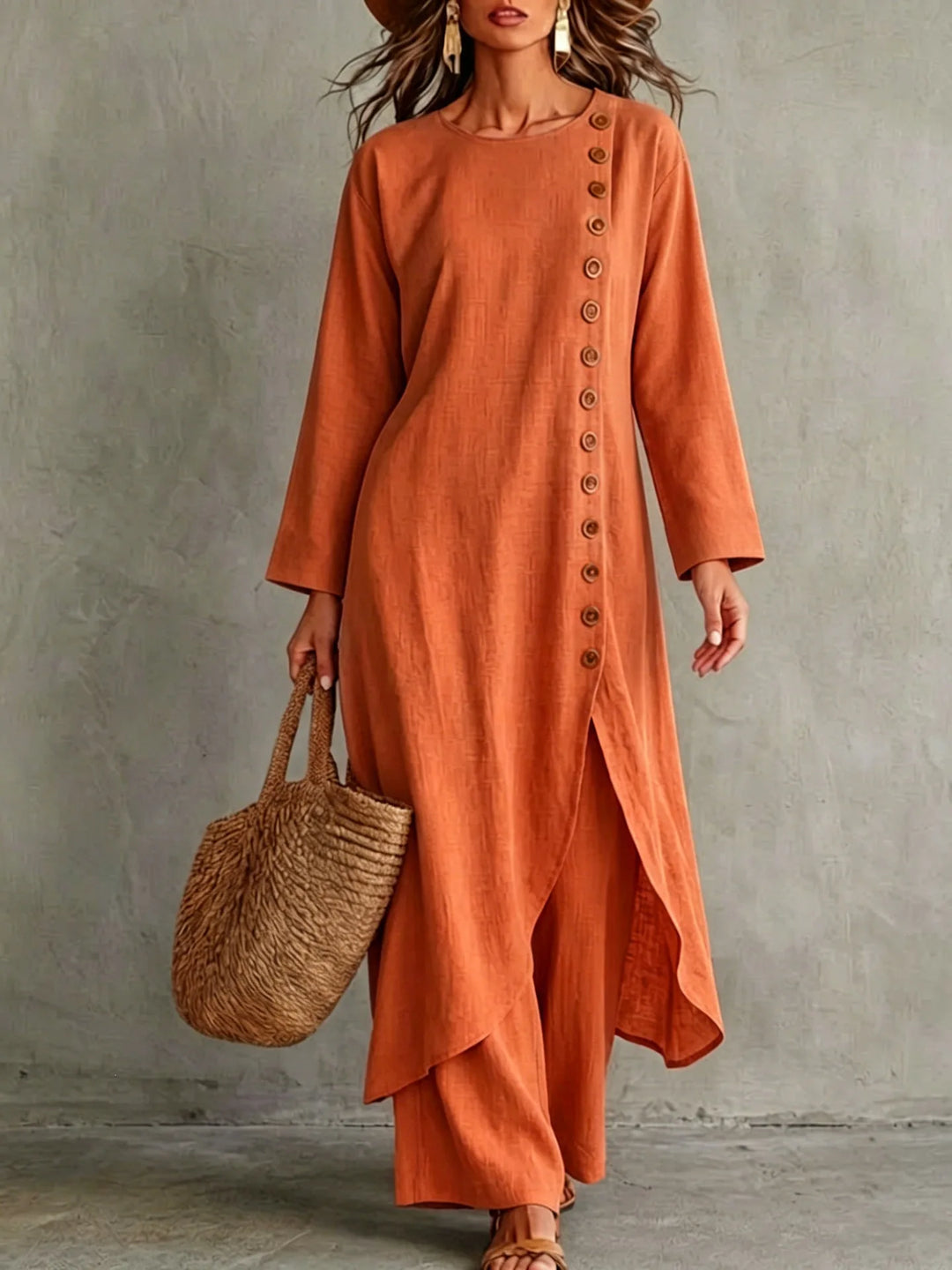 Close up of woman wearing orange two piece set with button placket top
