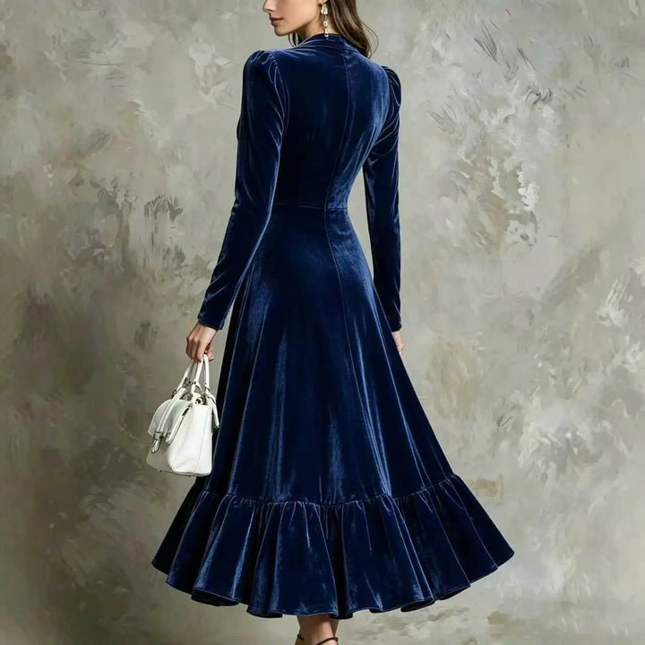 Back view of navy blue velvet midi dress with ruffled hem