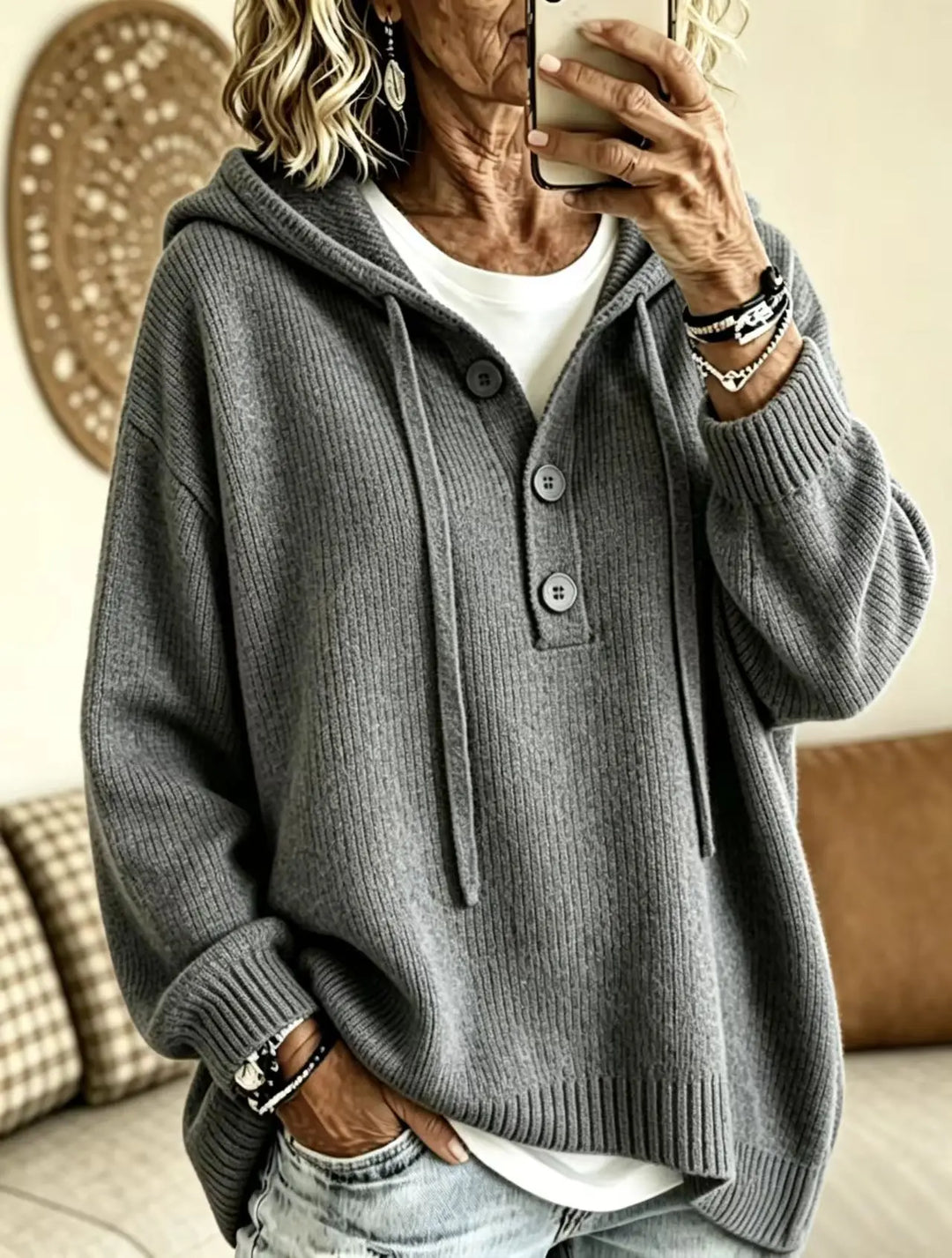 Woman wearing gray ribbed knit hoodie with button placket