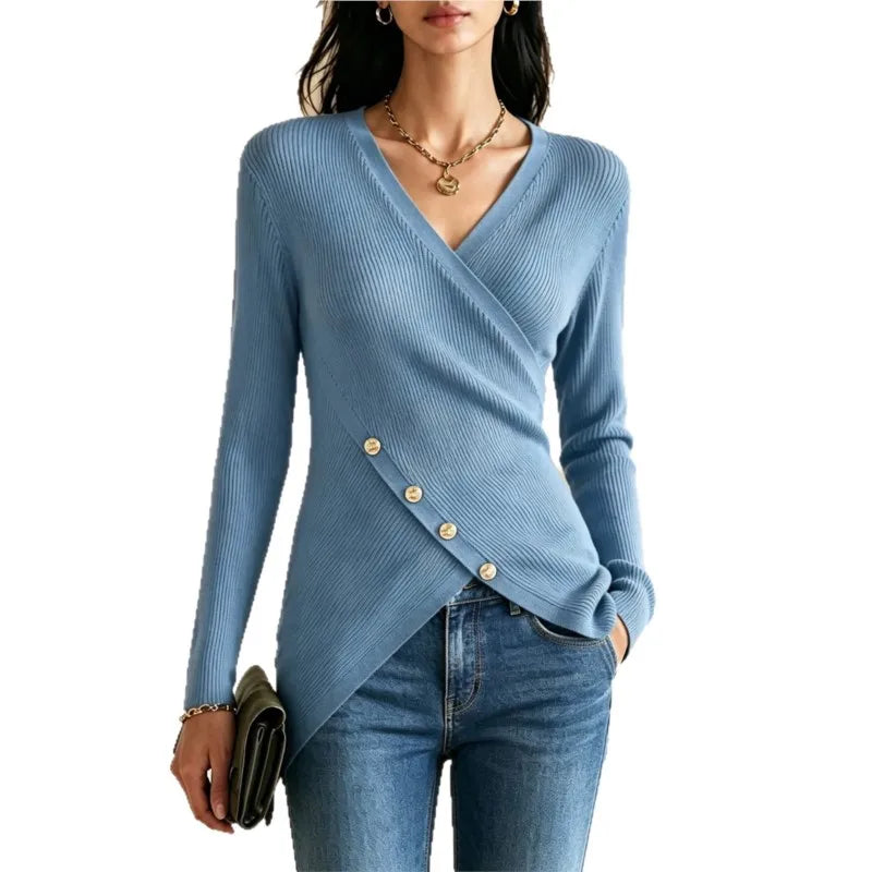 Woman wearing sky blue wrap-front ribbed knit top with gold buttons