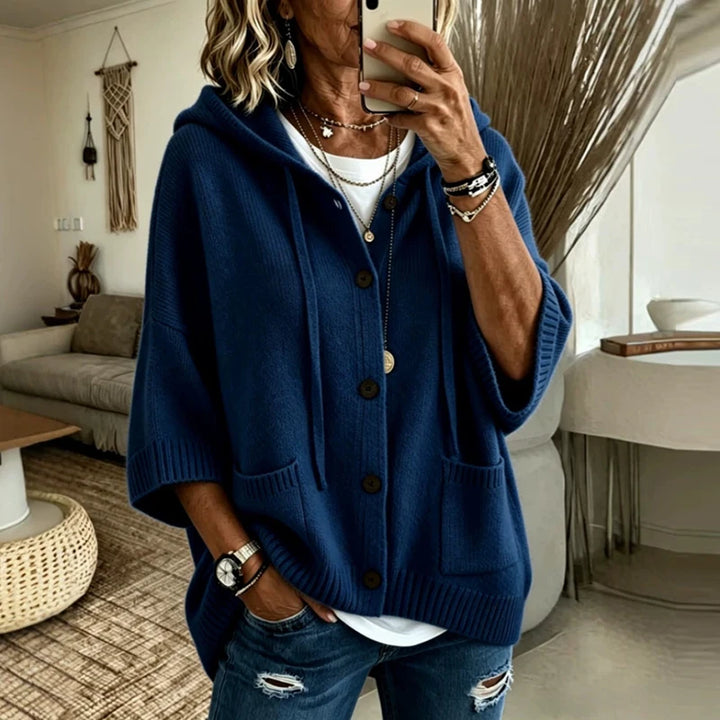 Woman wearing navy blue hooded button-front knit cardigan