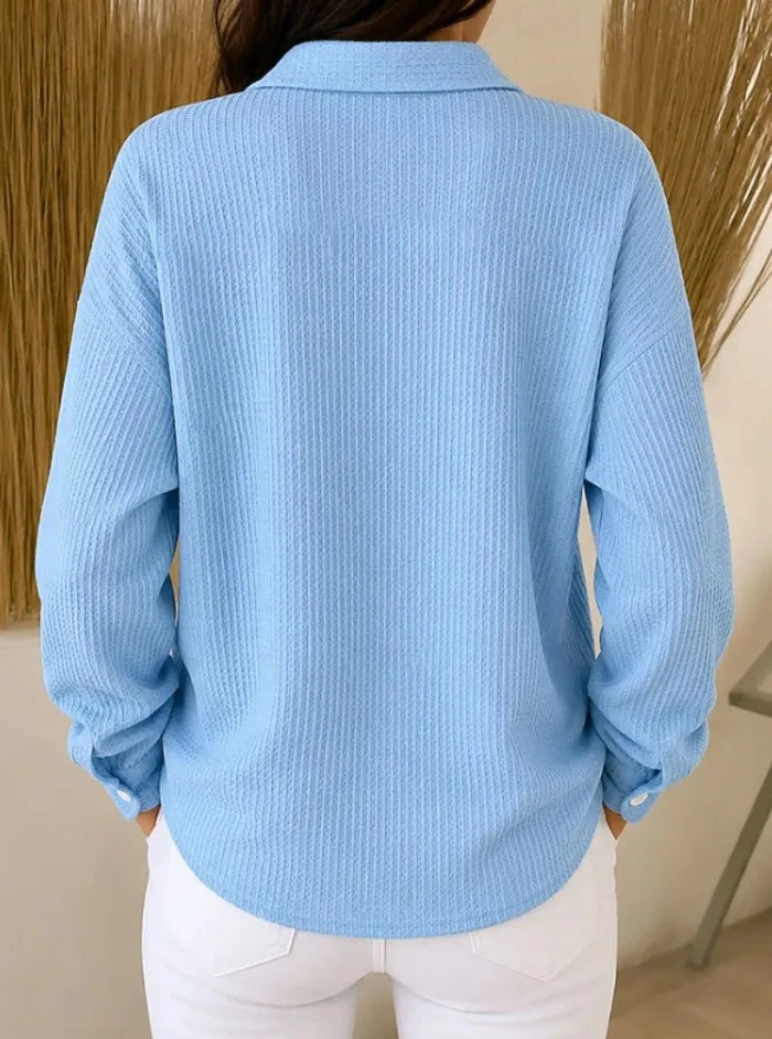 Back view of blue waffle knit button-front shirt