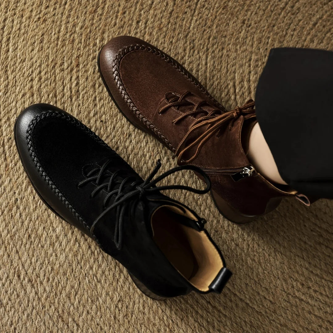 Black and brown suede ankle boots viewed from above