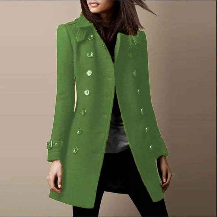 Woman wearing a green double-breasted mid-length coat, front view