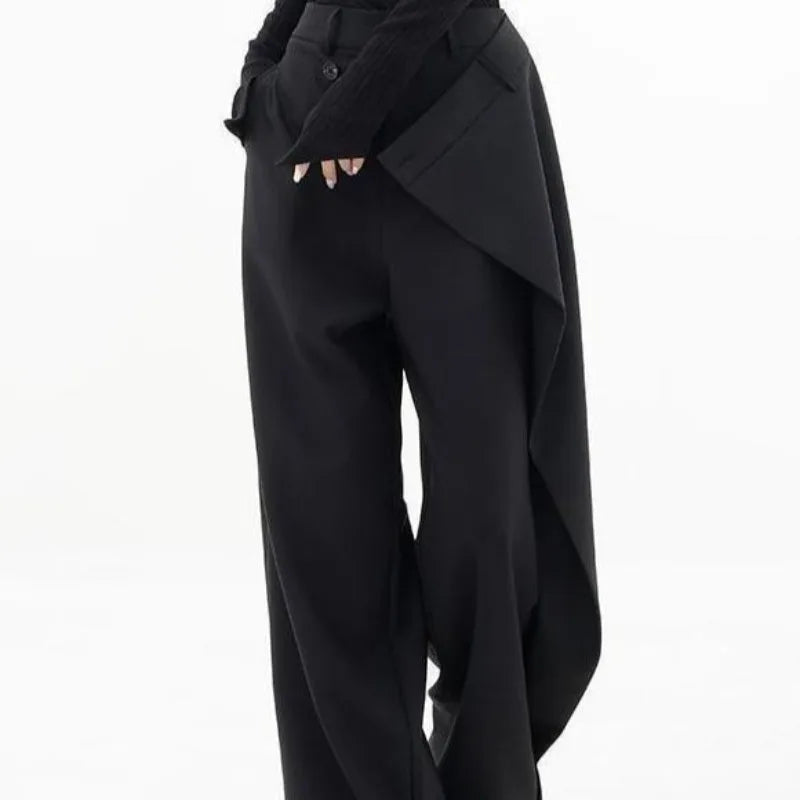 Black wide leg trousers side view showing draped wrap panel