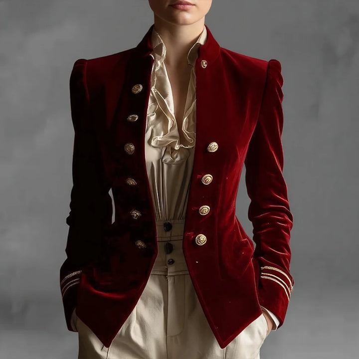 Woman wearing burgundy velvet double breasted blazer with stand collar