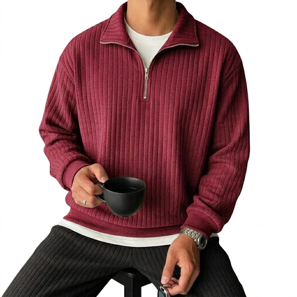 Man wearing wine red ribbed quarter-zip pullover, front view