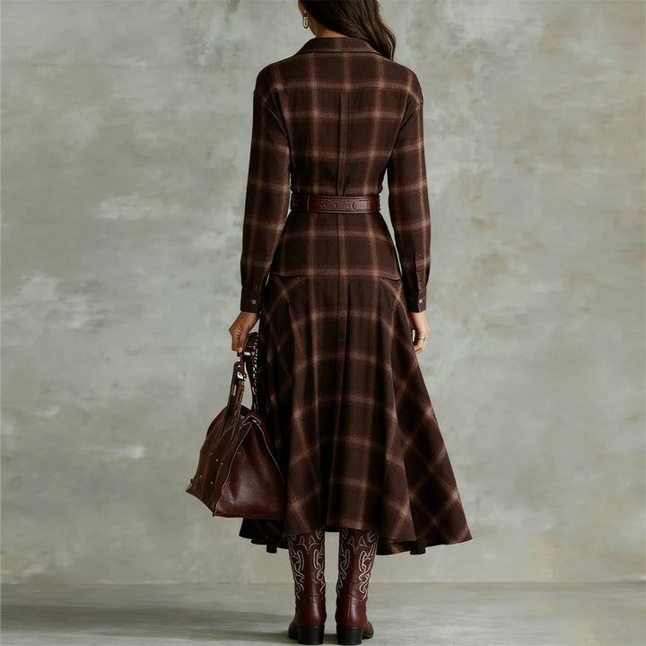 Back view of brown plaid shirt dress with belt and pleated skirt