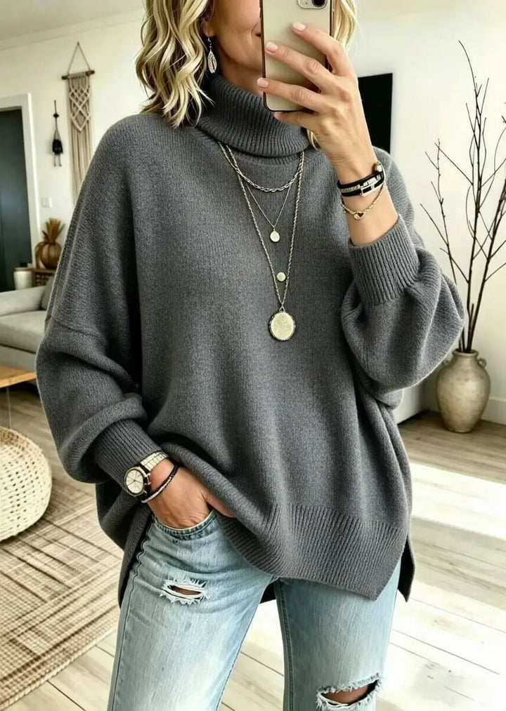 Woman wearing gray oversized turtleneck sweater
