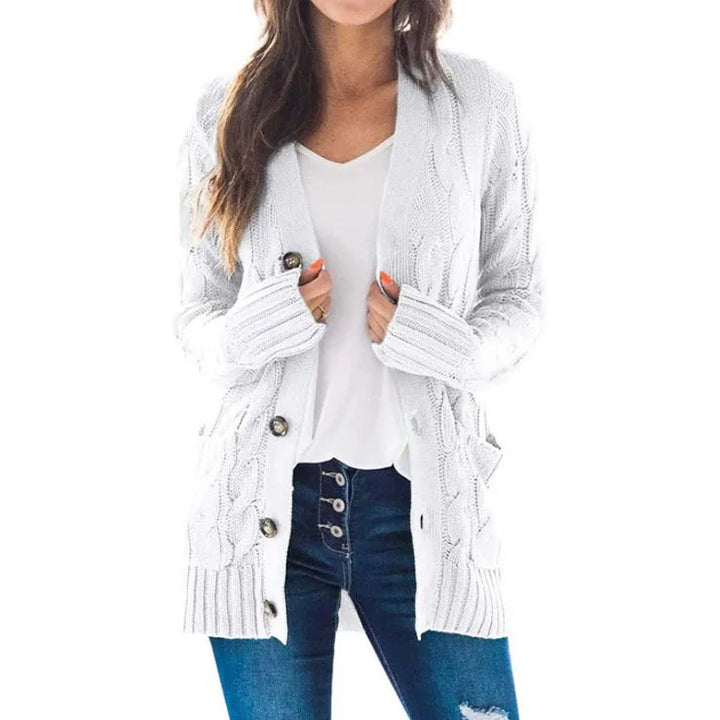 Woman wearing white cable knit cardigan