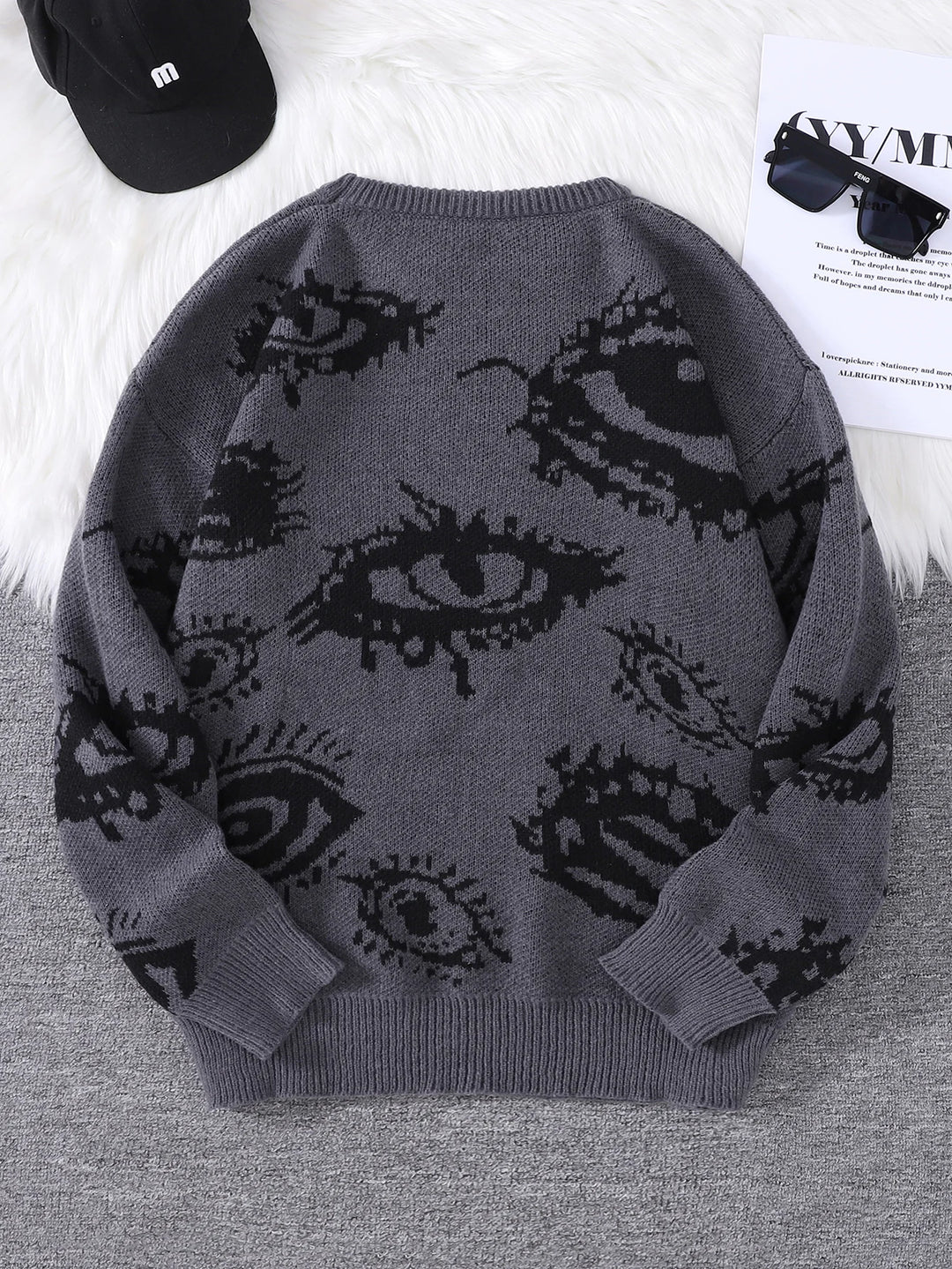 Dark grey eye print sweater back view flat lay