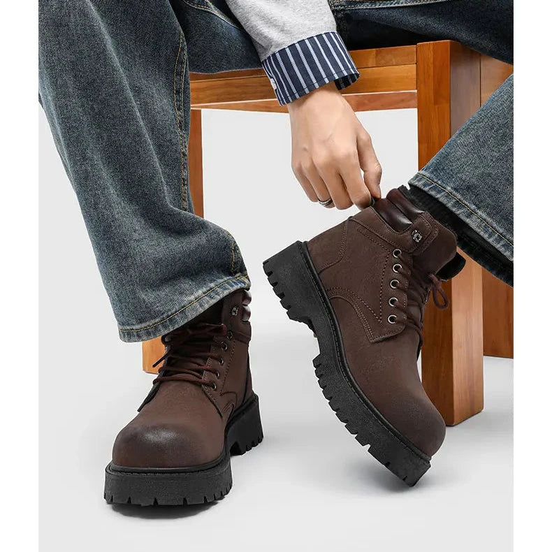 Man sitting wearing brown lace-up boots