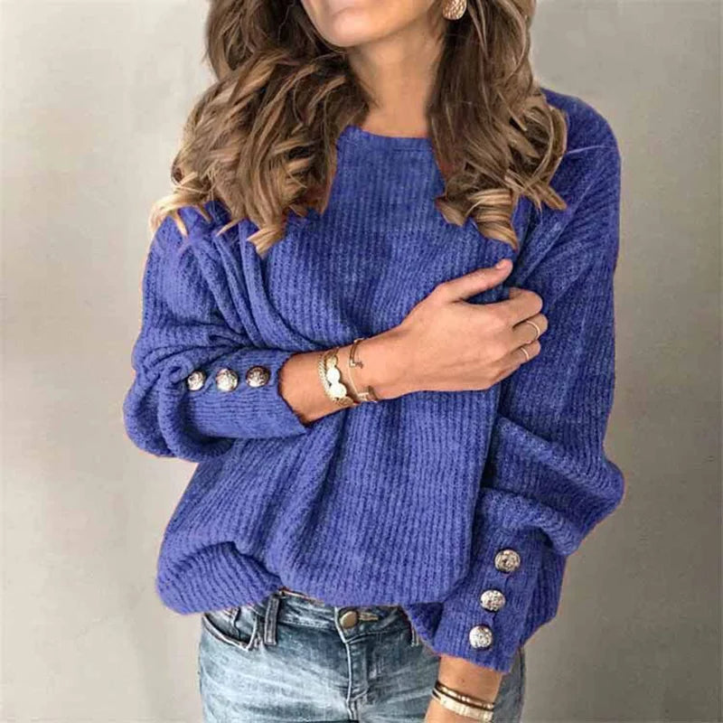 Woman wearing blue ribbed knit sweater with button cuffs, front view