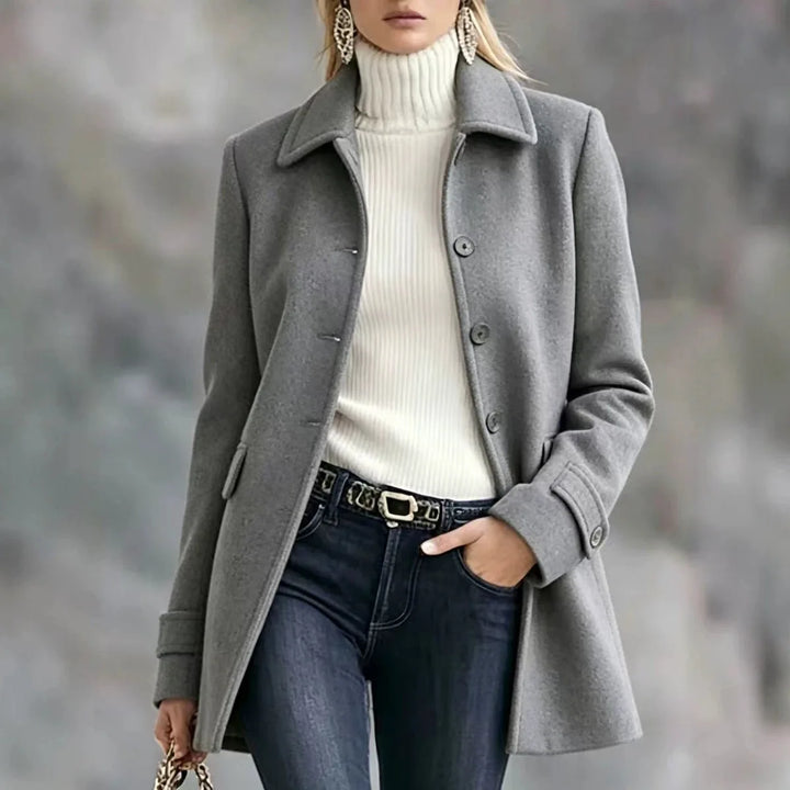 Woman wearing light grey notched lapel wool coat