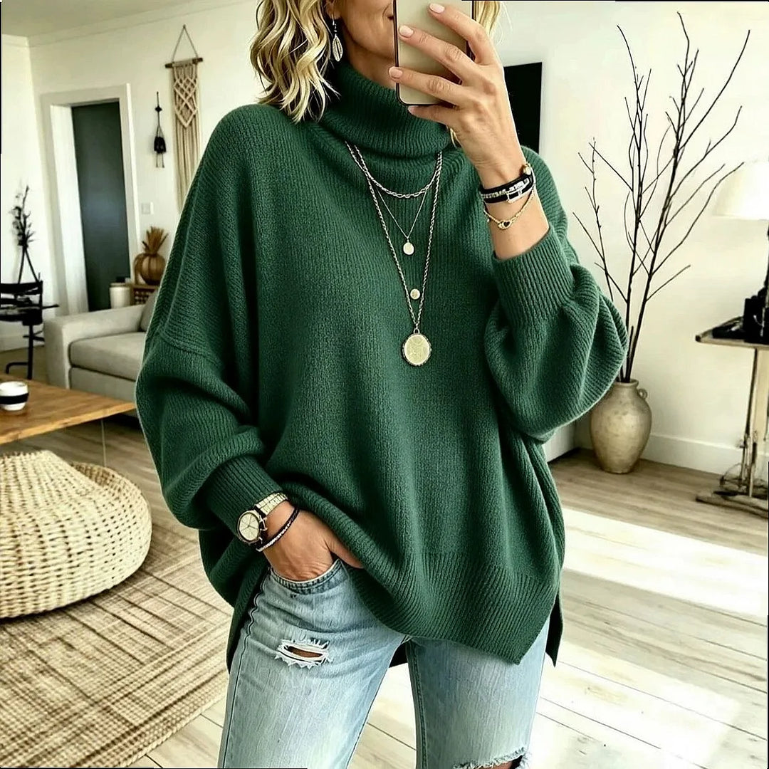 Woman wearing dark green oversized turtleneck sweater