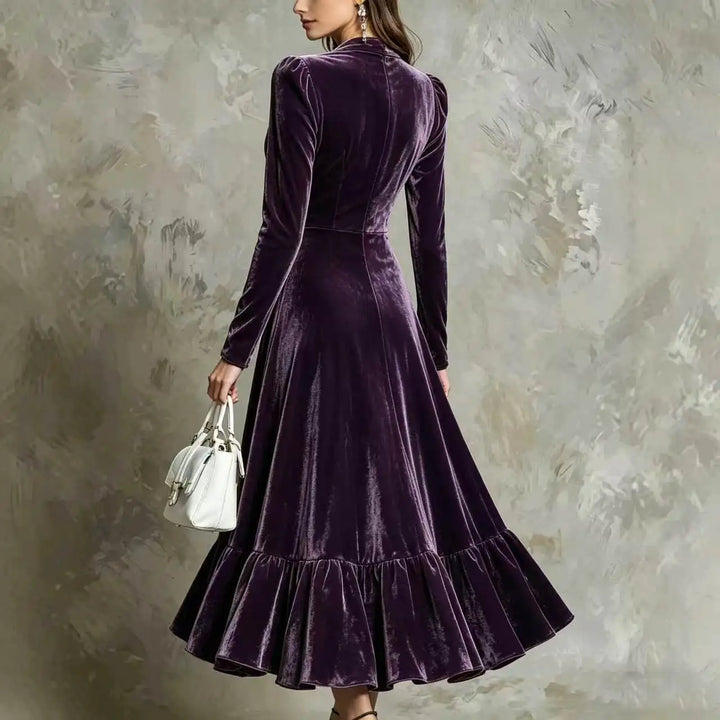 Back view of dark purple velvet midi dress with ruffled hem