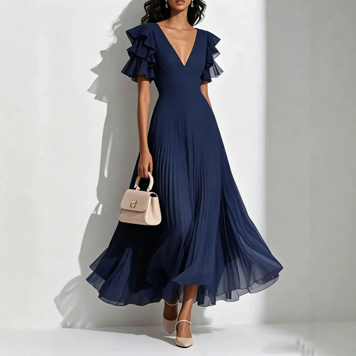 Navy pleated maxi dress with ruffle sleeves and deep V-neck, front view
