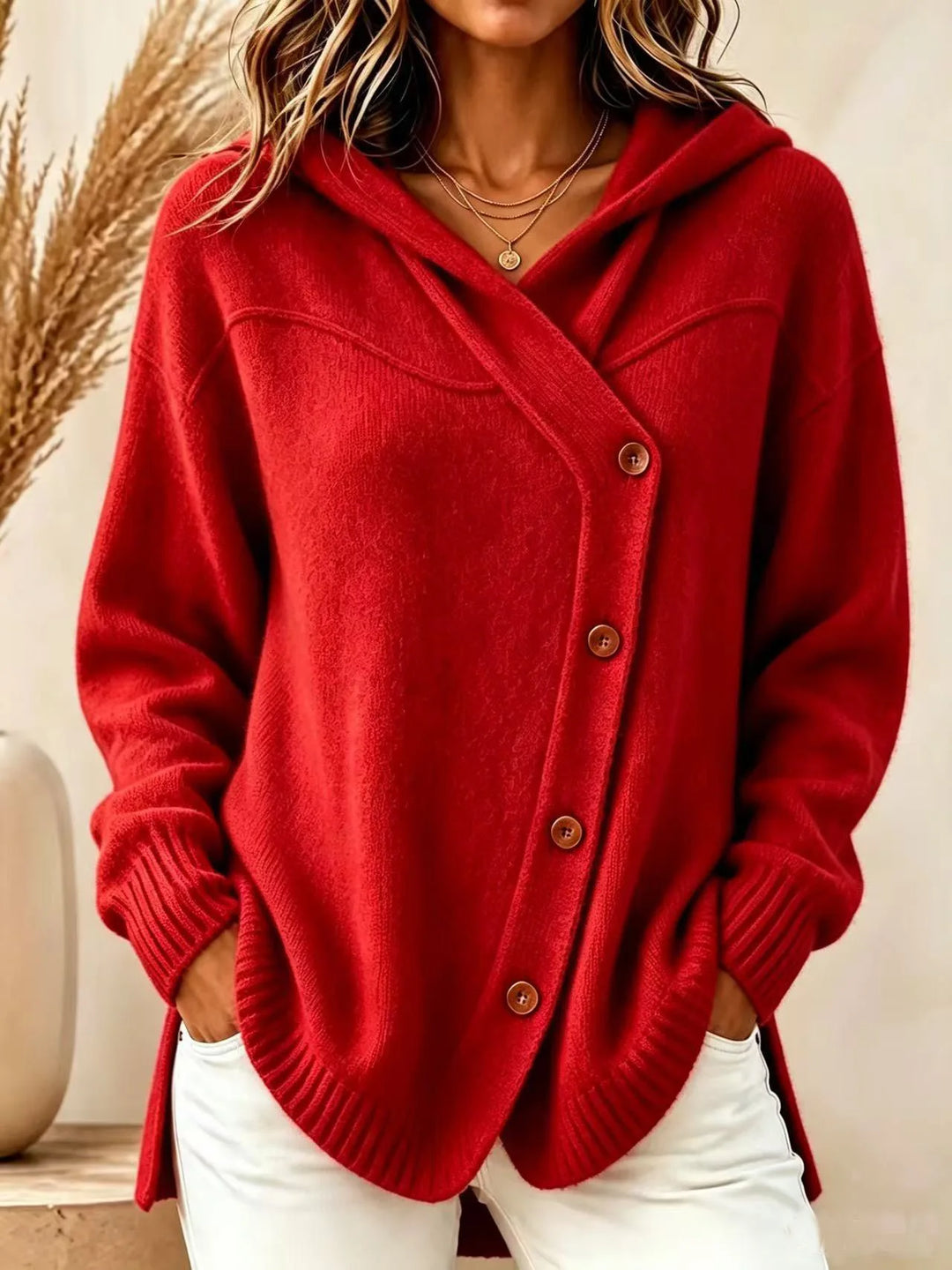 Red hooded knit cardigan with wooden button closure